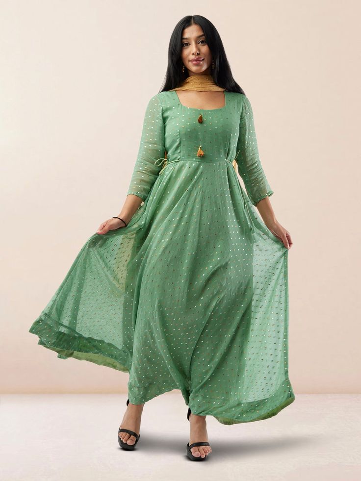 Step into elegance with our Enchanting Anarkali Sea Green Banarasi Georgette Anarkali Dress with Gold Butta. This ethereal anarkali dress features a sea green hue on exquisite Banarasi Georgette fabric adorned with intricate gold butta detailing, adding a touch of opulence. The flowy silhouette and traditional design make it ideal for weddings and festive occasions. Care Instructions: Dry clean or gentle hand wash to preserve the delicate fabric and embellishments. Georgette Anarkali Dress, Traditional Indian Dresses, Anarkali Dress Indian, Georgette Anarkali, Dresses For Weddings, Traditional Indian Dress, Dress Indian, Anarkali Suit, Anarkali Suits