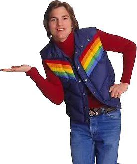 a man wearing a vest and holding his hands out to the side while standing in front of a white background