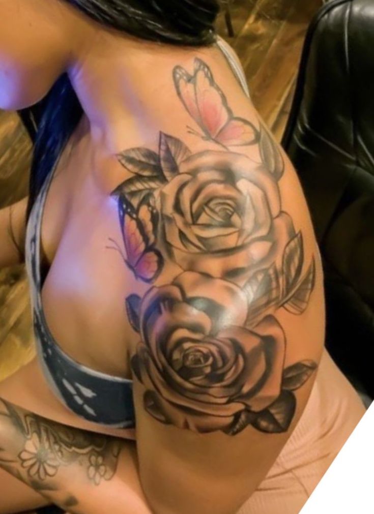 a woman with tattoos on her stomach