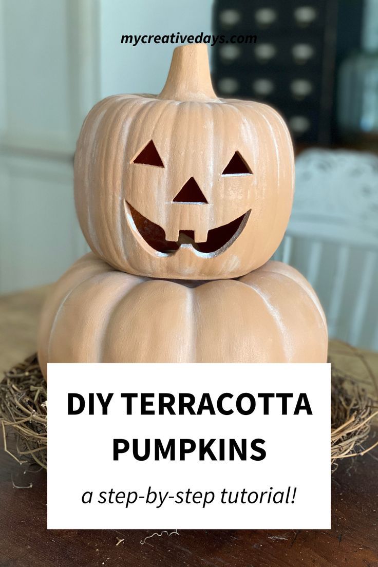 a wooden pumpkin sitting on top of a pile of hay with the words diy terracotta pumpkins