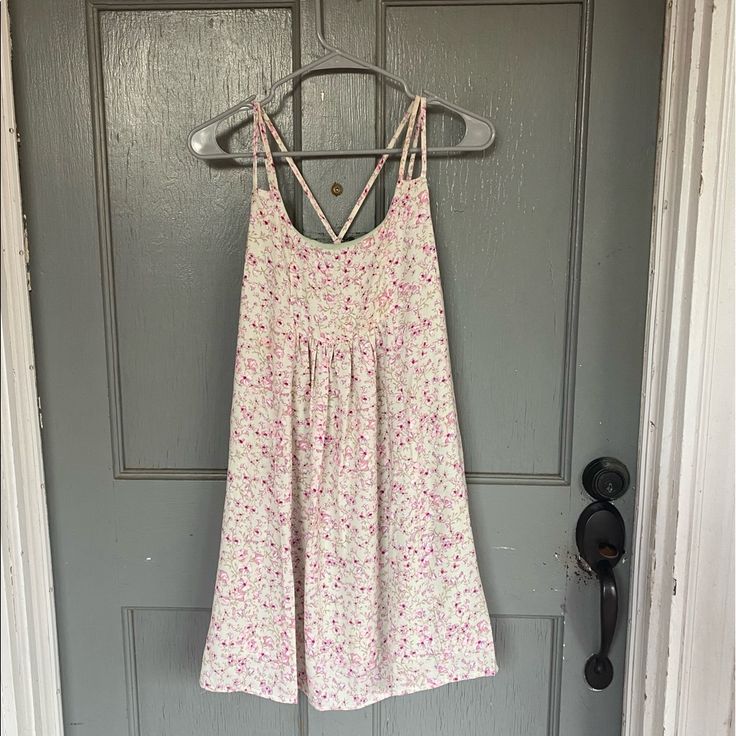 This Cute Dainty Floral Sundress From Altar’d State Is Perfect For Spring Or Easter! It Is New With Tags And Absolutely Adorable. The Back Has A Fun Cross Strap Pattern With Fun Stitching At The Base. Let Me Know If You Have Any Questions! Altard State Fall Outfits, Pink Ditsy Floral Print Mini Dress For The Beach, Pink Ditsy Floral Print Sundress For Spring, Pink Ditsy Floral Print Sundress For Day Out, Pink Ditsy Floral Print Mini Dress For Beach, Pink Mini Dress With Ditsy Floral Print For Beach, Pink Beach Mini Dress With Ditsy Floral Print, Pink Sleeveless Dress With Ditsy Floral Print, Pink Ditsy Floral Print Sundress For Brunch