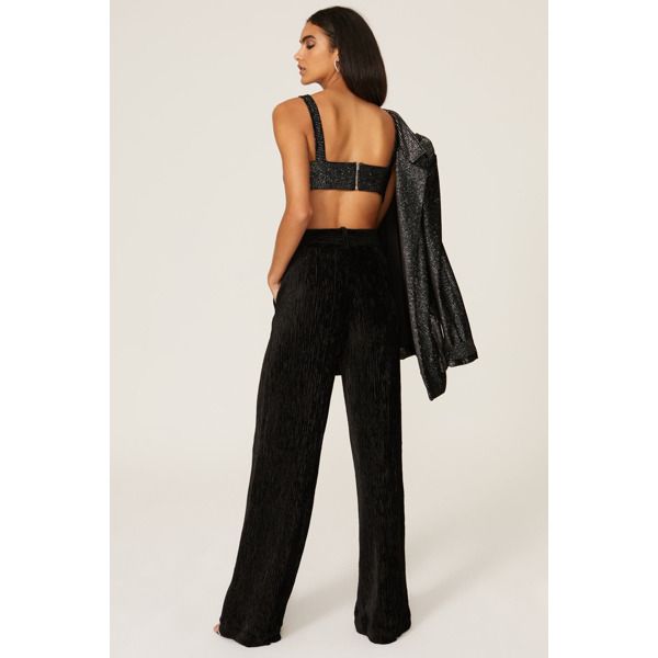 Black velvet (90% Polyester, 10% Elastane). Trouser. Front zipper closure. 40" from waist to hemline. 33.5" Inseam. 13" Rise. Imported. Chic Velvet Trousers, Fitted Velvet Bottoms For Night Out, Black Fitted Velvet Pants, Fitted Black Velvet Pants, Black Velvet Bottoms For Night Out, Wide-leg Velvet Pants For Party, Velvet Wide Leg Bottoms For Night Out, Black Velvet Pants For Party, Party Velvet Wide-leg Pants