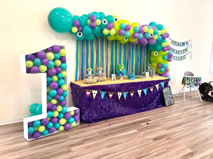 a birthday party with balloons, streamers and decorations