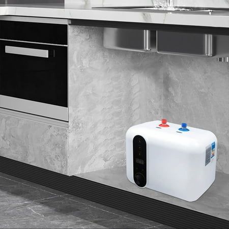 a large white tank sitting on the side of a kitchen counter next to a sink