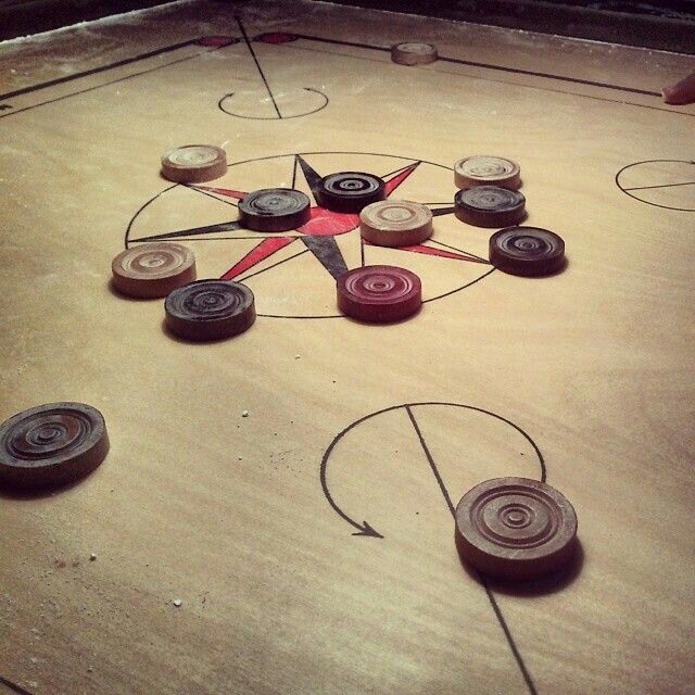 a close up of an air hockey rink with many different colors and shapes on it