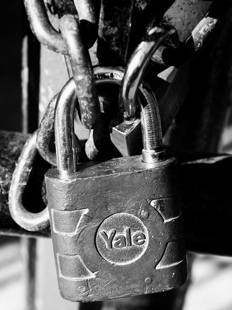 a padlock attached to a bench with the word vale written on it,