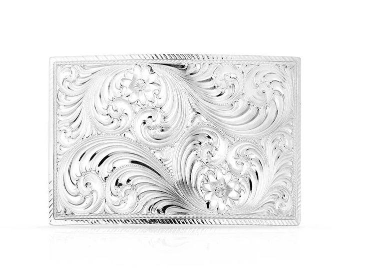 This Simple Classic Square Buckle is a timeless design that is perfect for any occasion. The square buckle features a bright silver tone. Classic western bright cut engraving covers the background of the buckle for a timeless design. Standard 1.5 inch swivel. Luxury Engraved Silver Belt Buckles, Classic Silver Belt Buckles With Polished Finish, Elegant Polished Belt Buckles For Formal Occasions, Silver Engraved Rectangular Belt Buckles, Rectangular Silver Engraved Belt Buckles, Rectangular Engraved Silver Belt Buckles, Silver Rectangular Engraved Belt Buckles, Formal Silver Belt Buckles With Polished Finish, Silver Rectangular Belt Buckles For Formal Occasions