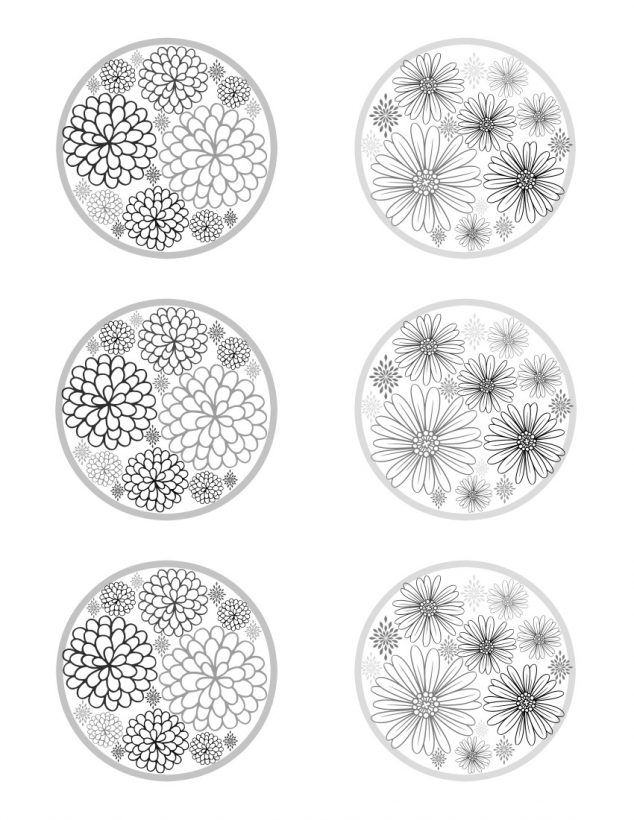 four plates with different designs on them, one is white and the other has black flowers