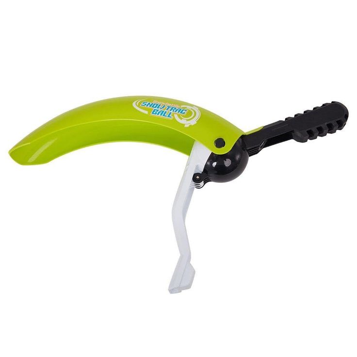 a green and black banana shaped scissors on a white background with clippings attached to the blades