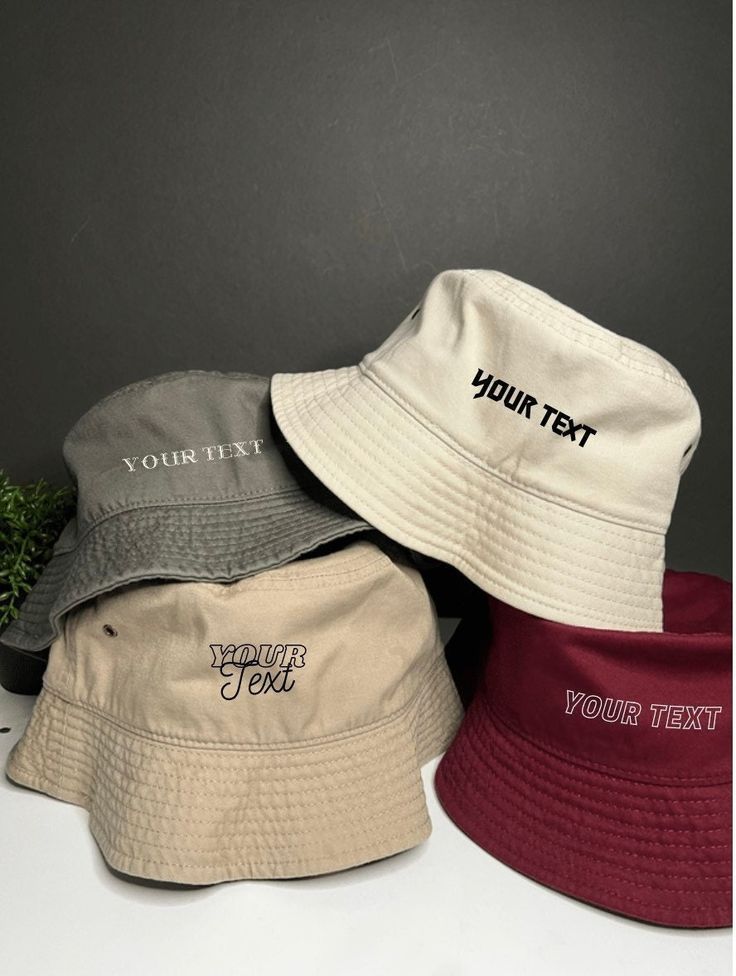 "Personalized embroidered bucket hats, custom bucket hats TEXT: In the 'Add your personalization' box, please enter 1.font choice 2.text 3.thread color Example: (#4, bebesota, Dusty pink) LOGO: In the 'Add your personalization\" box, please enter 1.thread color send us a message with a photo of the logo/design. BUCKET HAT ✧ -100% Cotton -Brim/Visor measures approximately 2 -Inner sweatband -2 brass eyelets for ventilation -Brim Wide 2 \" And 3.75 \" Deep Crown, **Size: S/M=56-57cm, L/XL=60-61cm" Trendy Summer Bucket Hat With Embroidered Logo, Cotton Bucket Hat With Embroidered Logo For Streetwear, Trendy Bucket Hat With Embroidered Logo, Customizable Cotton Hats With Curved Brim, Summer Bucket Hat With Embroidered Logo For Streetwear, Summer Streetwear Bucket Hat With Embroidered Logo, White Cotton Visor Bucket Hat, White Bucket Hat With Letter Print, Casual Wide Brim Bucket Hat With Embroidered Logo