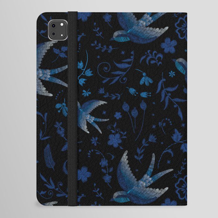 a phone case with blue birds and flowers on black leatherette fabric, front view