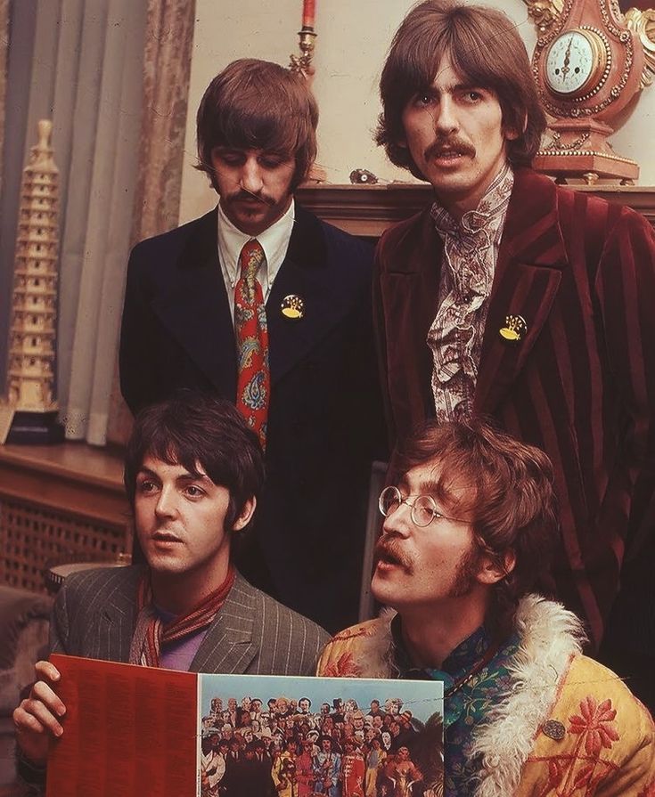 the beatles are posing for a photo together