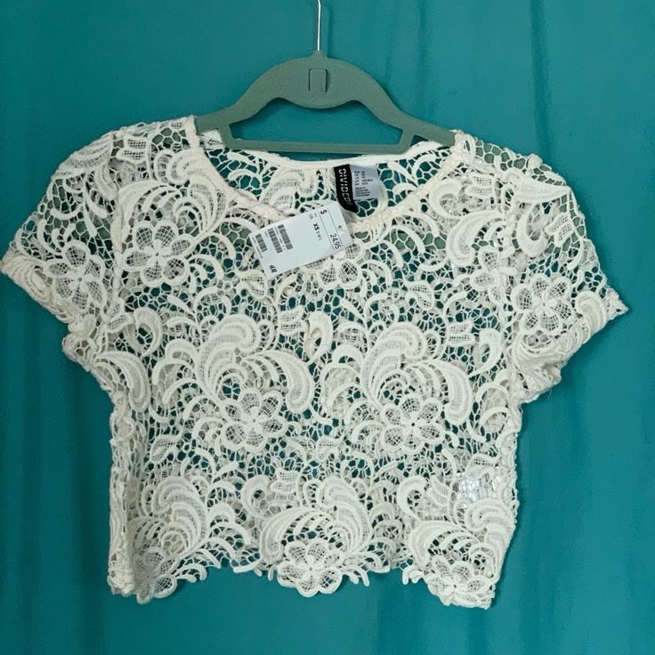 Lace Ivory Crop Top Beautiful Flower Pattern. From H&M Never Worn New With Tags Elegant Cream Crop Top For Spring, White Feminine Lace Crop Top, White Lace Crop Top In Feminine Style, Feminine White Lace Crop Top, Fitted Lace Top In Off White, Fitted Off White Lace Top For Summer, Casual Off White Lace Tops, Casual Off-white Lace Tops, Spring Lace Crop Top With Short Sleeves