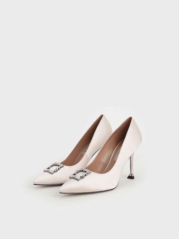 Add feminine flair to your evening look with these satin pumps in a flattering cream colour. These heels feature a pointed toe that helps to elongate your frame, while the gem embellishments imbue a sense of class and elegance. Go full glam by matching these shoes with a shimmered layered gown and beaded clutch for a dinner and dance event. Charles And Keith Shoes, Charles And Keith, Layered Gown, Shoes Heels Stilettos, Full Glam, Dance Event, Cream Wedding, Silver Pumps, Gold Pumps