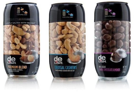 three cans with nuts in them on a white background