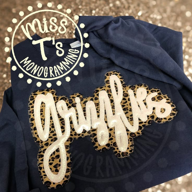 This listing is for a hand lettered double applique sweatshirt. These sweatshirts will have a layer of leopard fabric for the bottom and embroidery glitter vinyl for the top word/ team. These are so beautiful in person with the glitter lettering. The glitter is sealed and will not get on you.   Sizing: these sweatshirts fit true to size, so for an oversized fit, I recommend sizing up, especially if you want to wear with leggings.  No refunds on made to order items, but if anything is wrong, plea School Team Shirts Spirit Wear, Dance Studio Apparel, Vinyl Sweatshirt Ideas, School Team Shirts, Casual Teacher Outfit, School Spirit Shirts Designs, Applique Sweatshirt, School Spirit Wear, School Spirit Shirts