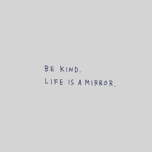 the words be kind, life is a mirror on a gray background