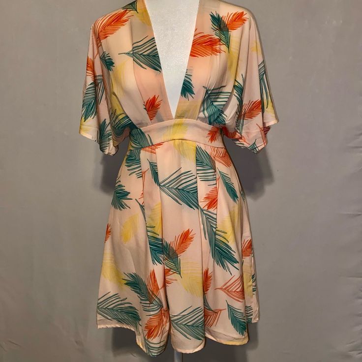 Shein “Plunging Tie Open Back Tropical Dress” Never Worn Before, Perfect Condition Open Back With Tie Behind The Neck Kimono Sleeves With Plunged Deep V-Neck Tropical Print Mini Hem Length 100% Polyester Machine Wash Or Professional Dry Clean Green V-neck Tropical Mini Dress, Multicolor Open Front Dress For Vacation, Multicolor Open Front Vacation Dress, Open Front Beachwear Dress For Brunch, Green Open Front Summer Dress, Printed Yellow Mini Dress With Short Sleeves, Yellow Printed Short Sleeve Mini Dress, Yellow Printed Mini Dress With Short Sleeves, Beige V-neck Mini Dress For Beachwear