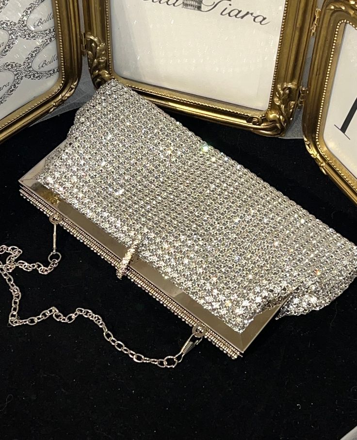 BELLA TIARA INTRODUCES OUR ELEGANT CRYSTAL PURSE COLLECTION A MUST HAVE FOR ANY SPECIAL OCCASIONAbsolutely stunning, dazzling, glamorous and elegant. Our Adora swarovski crystal clutch purse is perfect for all your essentials, soft and elegant removable chain satin lined. crystal all around, soft satin lined perfect for any size cell phonemeasures approx 8" long x 3 3/4" high. Available in silver frame setting or gold frame setting -------------------------------------- *Note processing time is Elegant Sparkling Bag, Elegant Sparkling Clutch Bag, Glamorous Sparkling Evening Bag, Chic Crystal Evening Bag For Weddings, Luxury Sparkling Evening Bag For Party, Sparkling Crystal Evening Bag, Elegant Sparkling Clutch For Formal Occasions, Elegant Sparkling Evening Bag, Elegant Sparkling Bags