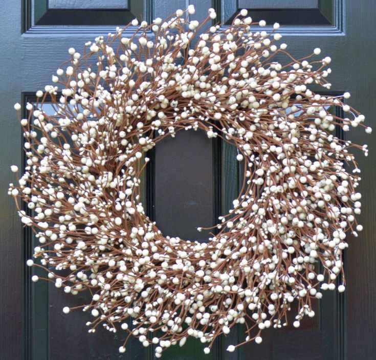 a wreath is hanging on the front door