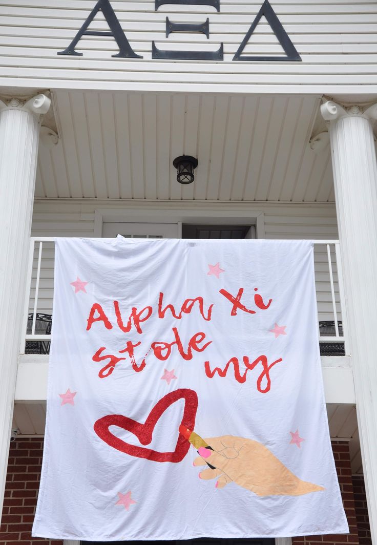 a banner that says aloh x stole my heart on the side of a building