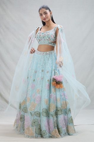 Blue attached cancan lehenga with all over flower vine, sequin, thread embroidery. Paired with a padded blouse with attached cape sleeves and floral, sequin, cutdana embroidery. - Aza Fashions Blue Anarkali Set With Floral Embroidery For Spring, Spring Blue Anarkali Set With Floral Embroidery, Spring Wedding Lehenga With Resham Embroidery, Spring Wedding Lehenga With Traditional Drape, Spring Wedding Blue Sharara, Bollywood Style Lehenga For Spring Wedding, Spring Bollywood Wedding Lehenga, Spring Wedding Bollywood Choli, Anarkali Lehenga For Spring Wedding