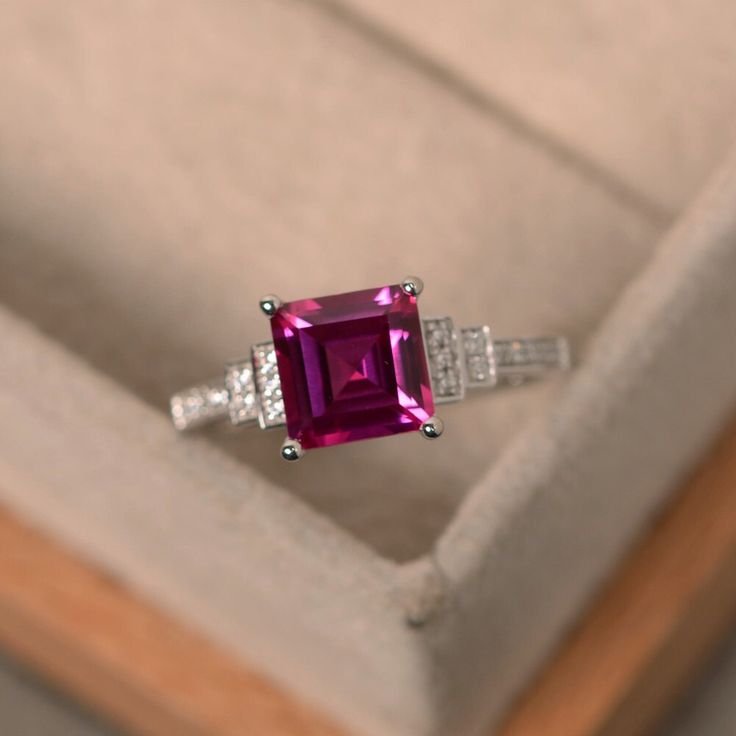 This halo ring features a 7mm*7mm square cut lab ruby and sterling silver finished with rhodium. Customization is available. It is made by hand, and it will take about 7 days to finish the ring after your payment is completed. Any question, just let me know. :) My shop homepage: https://www.etsy.com/shop/LuoJewelry?ref=l2-shopheader-name Ruby Diamond Engagement Ring, Birthstone Engagement Rings, July Birthstone Ring, Ruby Engagement Ring, Dream Engagement, Engagement Ring Sizes, Red Gemstones, July Birthstone, Ruby Diamond