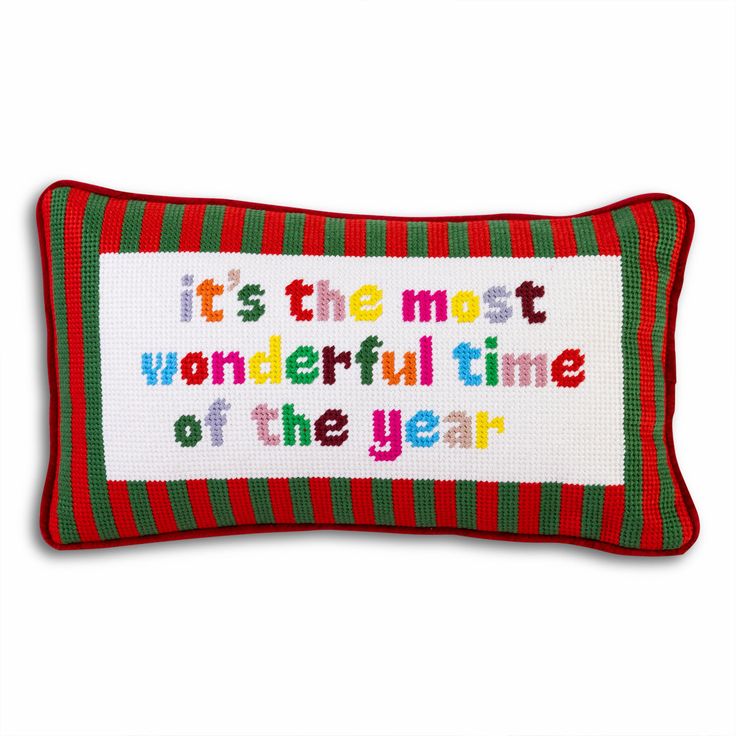 a red and green pillow with the words it's the most wonderful time of the year