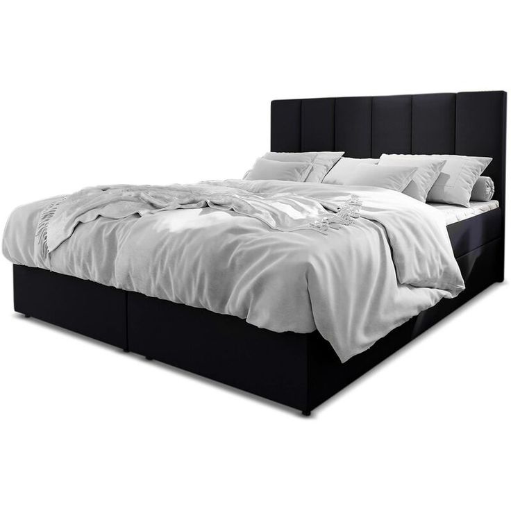 a black bed with white sheets and pillows