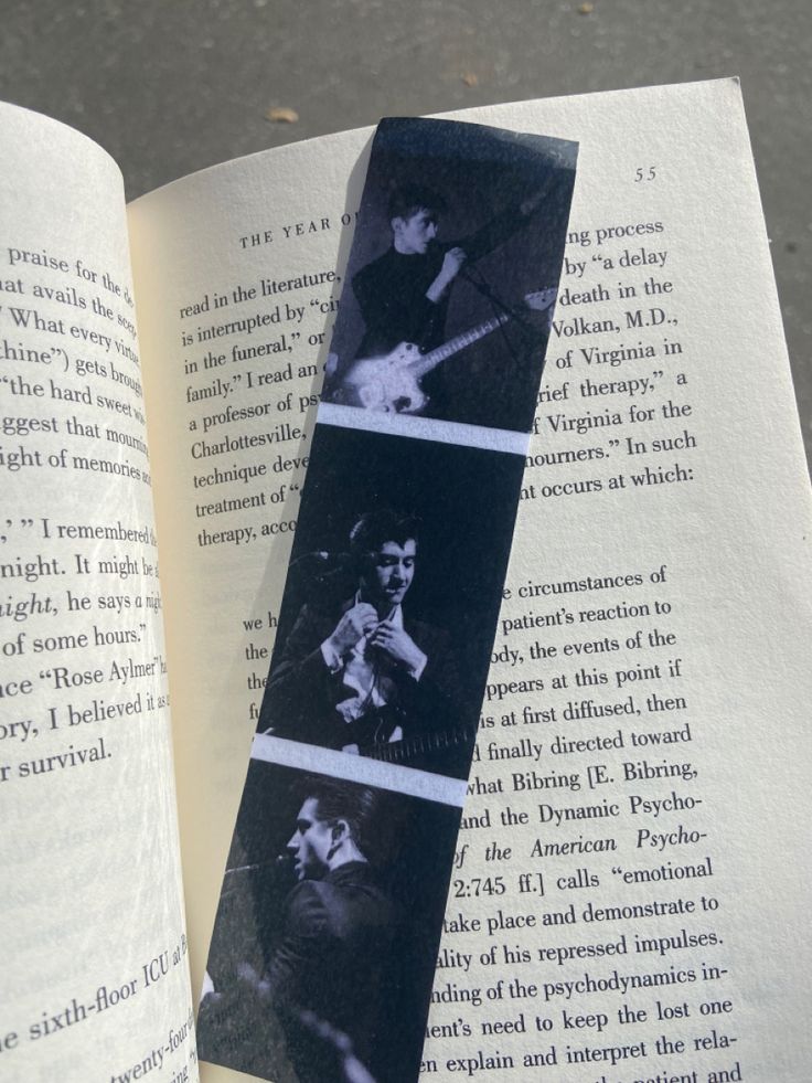 an open book with pictures of people playing guitar on it's pages and the title page is black and white