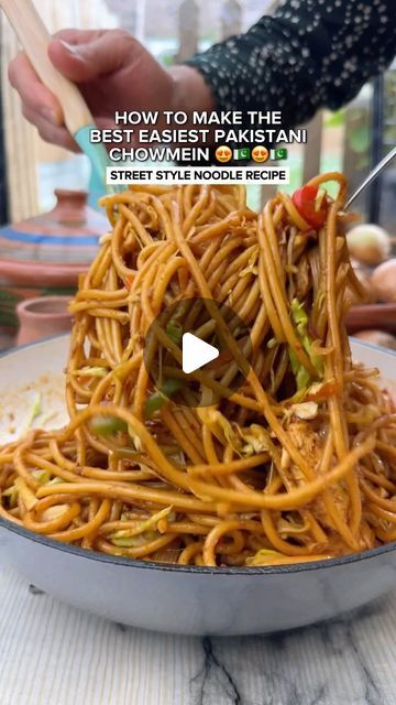 someone is eating noodles with chopsticks in their hand and the video below shows how to make the best easyest pakitai chow mein