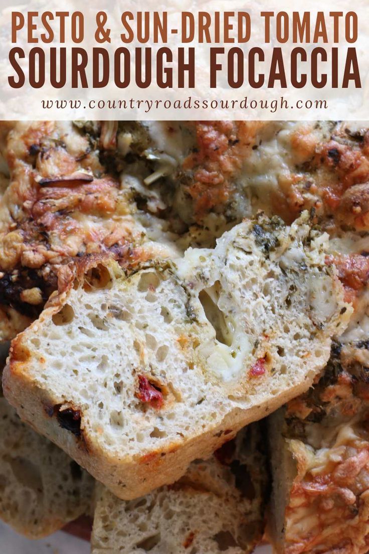 some bread that is cut in half and sitting on top of a plate with the words pesto & sun - dried tomato sourdough focacia