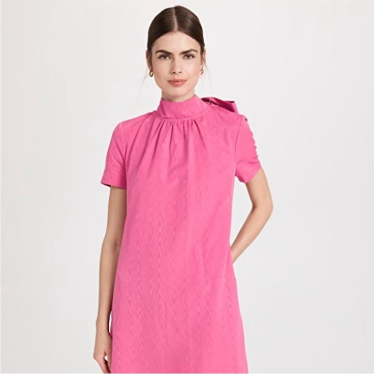 At The Heart Of Staud Is Design. Think Attention To Detail, Opposition To The Ordinary, And A Feminine Aura. A Blend Of Originality And Style Make This A Cult-Favorite Brand Of Fashionistas And Celebrities. In A Vibrant Bright Pink, The Lollipop Mini Ilana Dress Is A Real Showstopper. With A Sophisticated Mock Neck, A Scoop Back With A Self-Tie Bow, And A Swingy A-Line Skirt, This Mini Is The Perfect Statement Piece For Any Occasion. Style With Pumps And A Clutch For A Stand-Out Look To Wear To Chic A-line Mini Dress By Staud, Staud A-line Dresses For Spring, Staud Dresses For Daywear, Staud A-line Dresses, Fitted A-line Dresses By Staud, Staud A-line Fitted Dresses, Fitted Knee-length Dress By Staud, Staud Fitted Knee-length Dress, Staud A-line Evening Dress