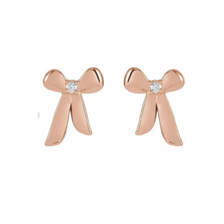 Our 14K flirtatious and fun Gold and Diamond Bow Earrings are the perfect feminine accessory to any ear stack. Available in 14k white gold, yellow gold, and rose gold 0.05ct total carat weight Diamond Color: G-H / Clarity: SI1 Length: 7.2mm / Width: 10.24mm Made to order. Lead time is 2 weeks. Benefits of Solid 14k Gold Jewelry Most loved for its durability and longevity Can be worn daily and requires less maintenance and care than plated, vermeil, or silver jewelry Sweat/water resistant so you Diamond Bows, Custom Wedding Rings, Ear Stack, Bow Earrings, Womens Wedding Bands, Diamond Color, Rose Gold Earrings, Custom Engagement Ring, Wedding Rings For Women