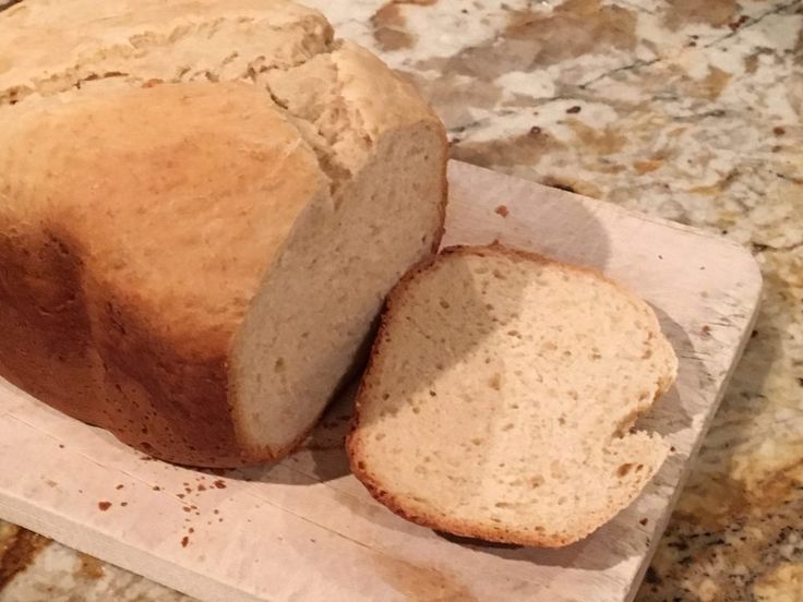 a loaf of bread sitting on top of a cutting board