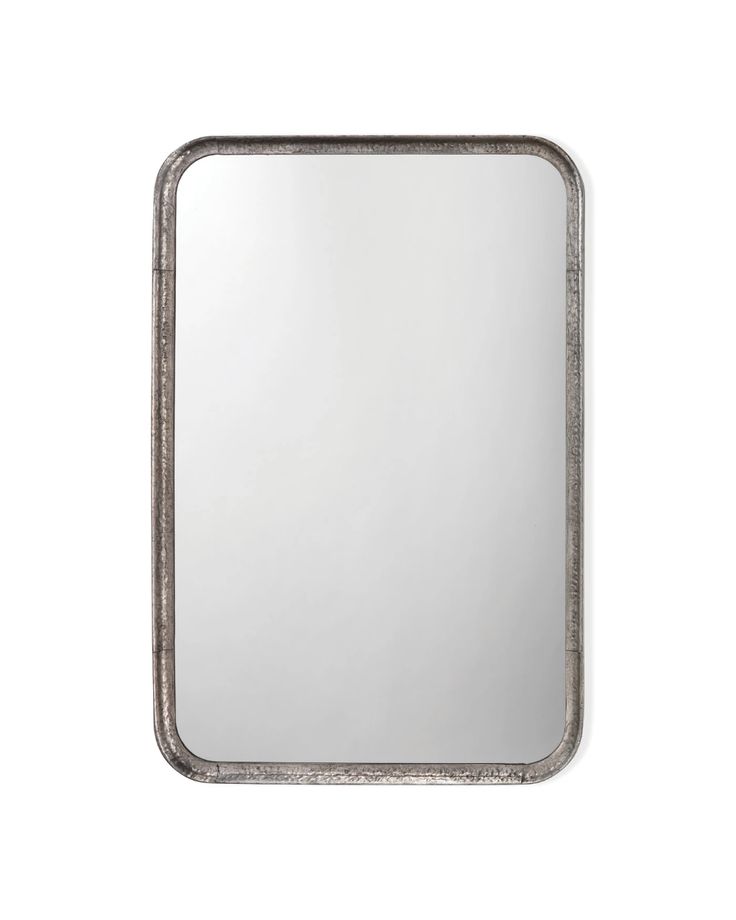 a square mirror with silver trim on the bottom and an oval frame in the middle