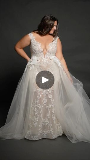 a woman in a wedding dress with her hands on her hips