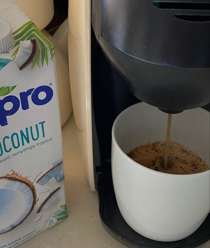 a box of propro coconut milk next to a coffee maker