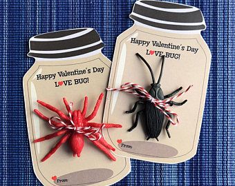 two valentine's day tags with red and black bugs in them on a blue background