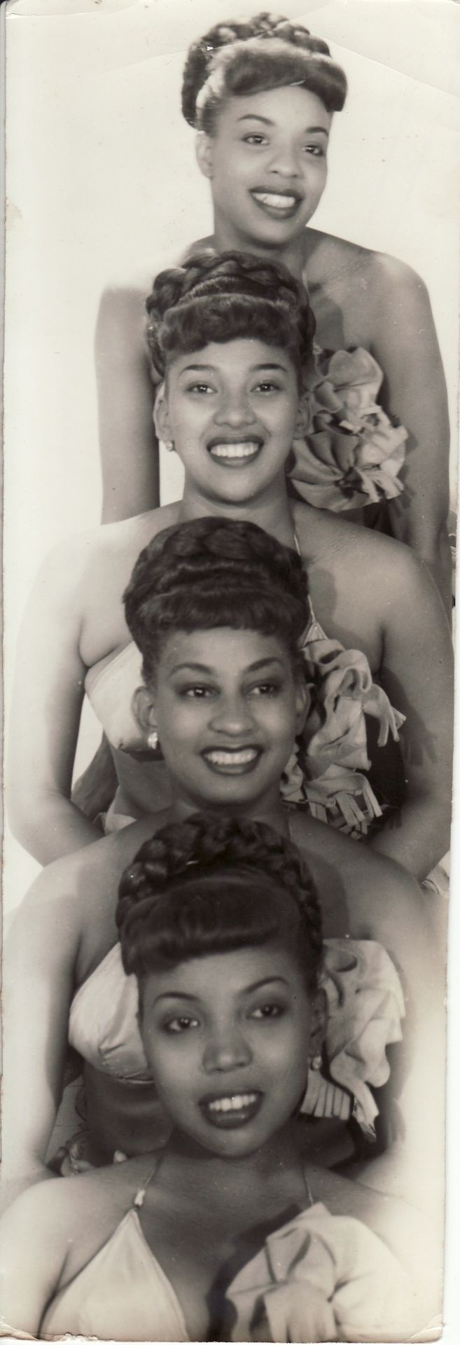 an old black and white photo of four women