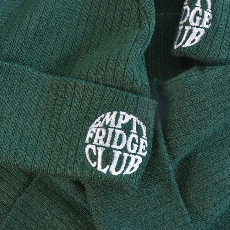 The EFC Classic Embroidered Beanie features our signature logo in high quality embroidery on a jungle green mid-weight beanie suitable for all seasons! This beanie is constructed with 50% recycled polyester obtained from the recycling of used plastic bottles, and 50% acrylic. Wear the cuff-embroidered logo on whichever side you want! One size fits most. Beanies Embroidery, Cheap Embroidered Beanie One Size Fits Most, Beanie Embroidery, Cheap Beanie With Embroidered Logo, Luxury Winter Hat With Embroidered Logo, Casual Embroidered Logo Beanie For Winter, Casual Embroidered Winter Beanie, Winter Embroidered Beanie, Winter Beanie With Embroidered Logo