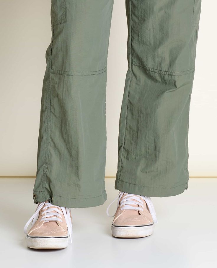 Proof that hiking pants don’t have to be dorky. Ankle length with the option to cinch or not, keep your snacks safe in velcro flap cargo pockets and your midsection pinch-free with encased elastic. Sporty Nylon Cargo Pants With Belt Loops, Functional Parachute Pants With Belt Loops For Outdoor, Straight Leg Cargo Pants For Hiking, Green Utility Hiking Bottoms, Utility Nylon Bottoms For Outdoor, Nylon Parachute Pants With Belt Loops For Outdoor Activities, Utility Hiking Pants With Pockets, Outdoor Parachute Pants With Cargo Pockets And Straight Leg, Utility Hiking Pants With Cargo Pockets