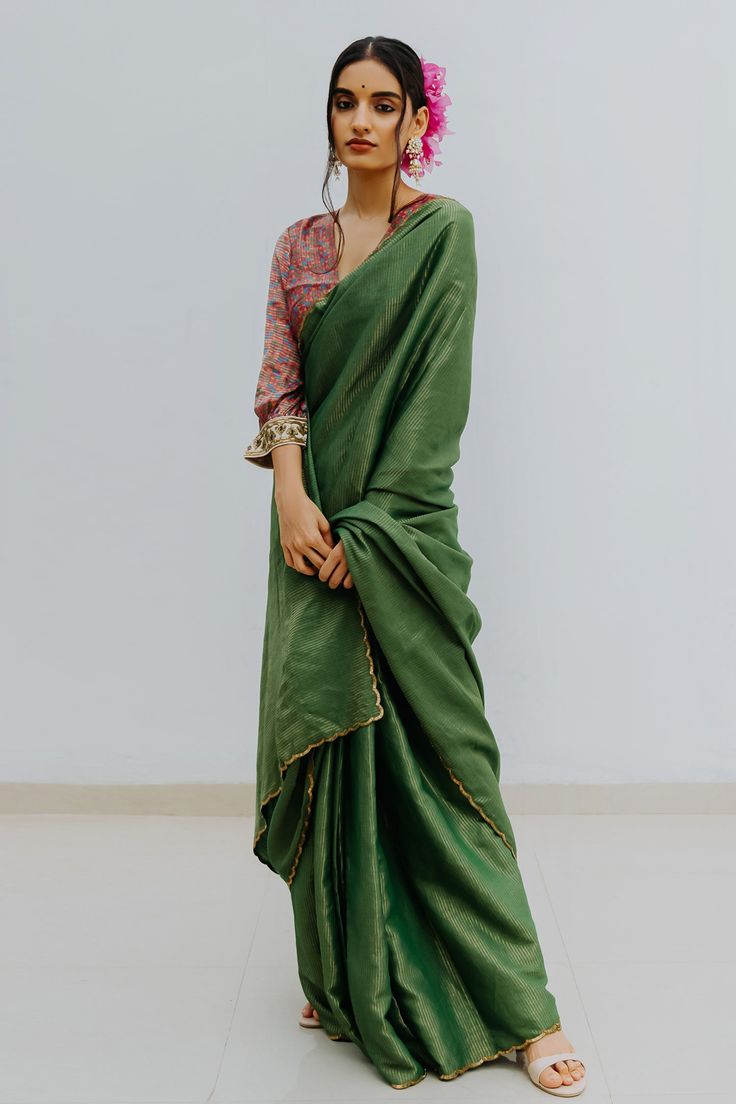 Emerald green saree with contrast woven stripes and zardozi embroidered border. Paired with printed magenta unstitched blouse fabric.
Component: 2
Fabric: Handloom Munga Silk
Color: Green
Blouse fabric: 1 metre
Note: Blouse worn by the model is not for sale - Aza Fashions Striped Saree, Saree Green, Saree Blouses Online, Saree For Women, Silk Saree Blouse, Green Saree, Blouse For Women, Designer Gowns, Green Blouse