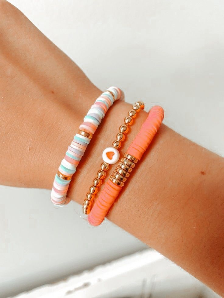 two bracelets with beads on each arm