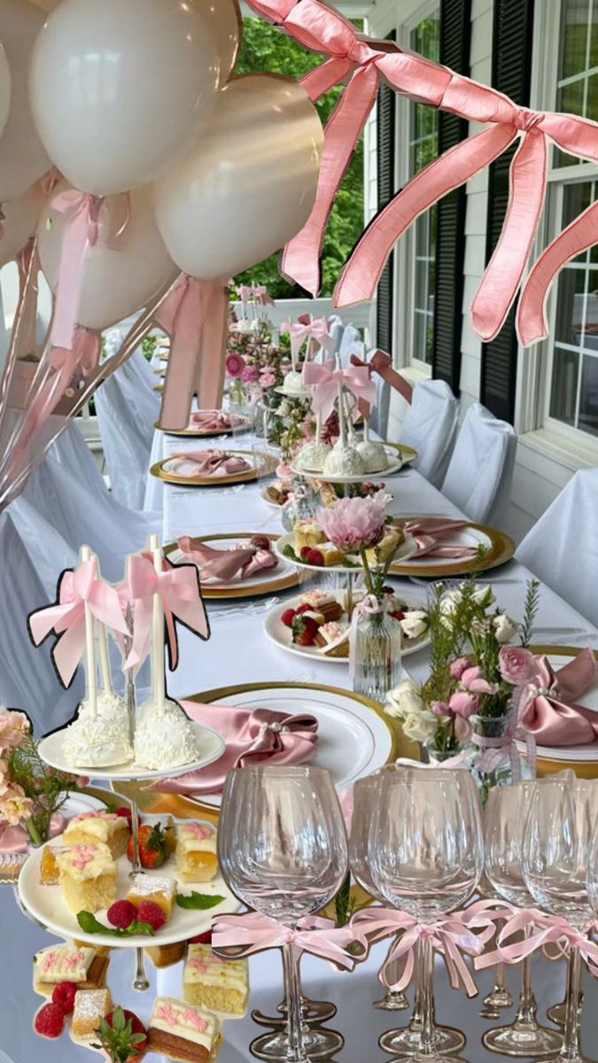 a table set up for a party with balloons and desserts