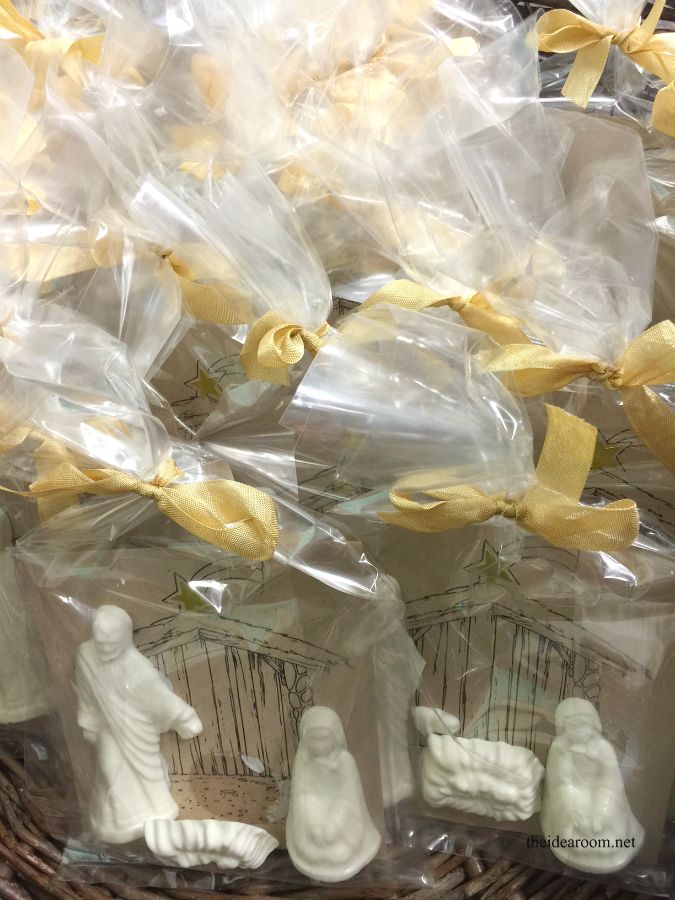 small figurines in plastic bags sitting on top of a basket filled with other items