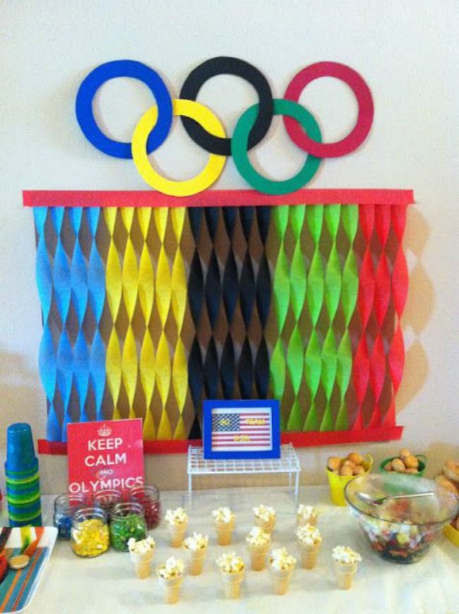 an olympic themed dessert table with candy and candies