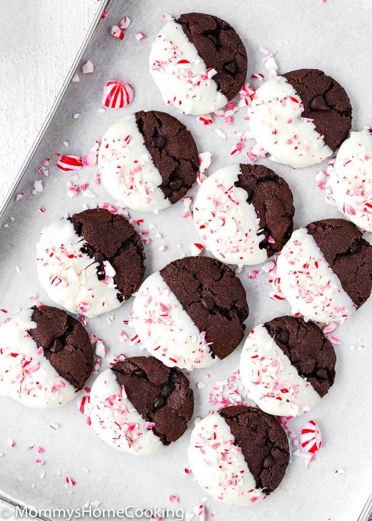 chocolate cookies with white frosting and candy canes