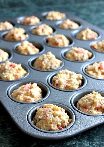 a muffin tin filled with some kind of food