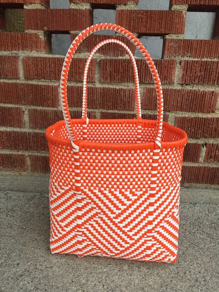 "This beautiful hand-woven, small tote is the latest creation of my business parter Cupertino. The last two pictures are for demonstration purposes only. You are actually buying the bag shown in the first three pictures. Handcrafted in Mexico. 9 1/2\"L x 9 1/2\"H x 5\"D; 16\" H with straps." White Woven Tote Bag, White Weaving Tote Bag, White Bags With Weaving For Daily Use, White Woven Leather Bucket Bag, Casual White Woven Leather Bag, Orange Woven Bag For Shopping, Casual Orange Bags For Market, Orange Basket Bag For Everyday Use, White Square Bag For Market